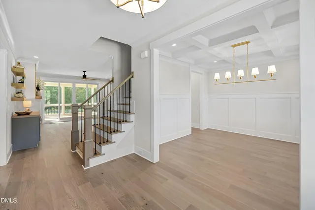 a view of entryway and hall with wooden floor
