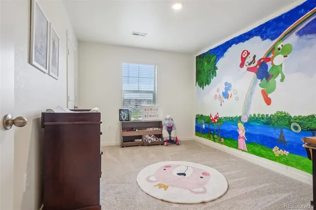 wooden floor with furniture and a potted plant