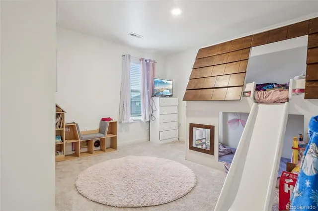 a view of a livingroom with furniture and staircase