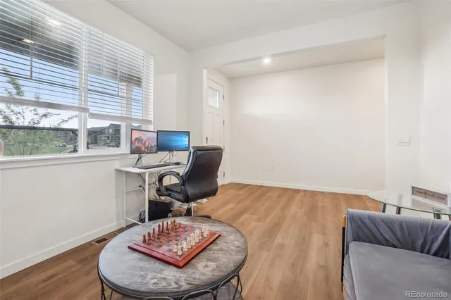 a workspace with furniture and a window