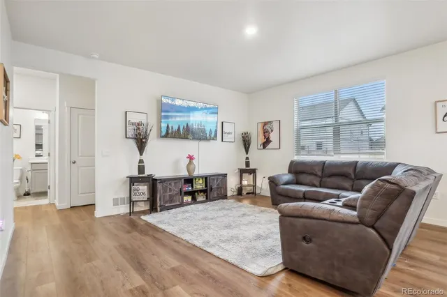 a living room with furniture and a table