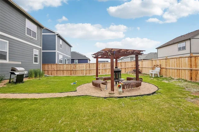 a view of a patio with a table and chairs