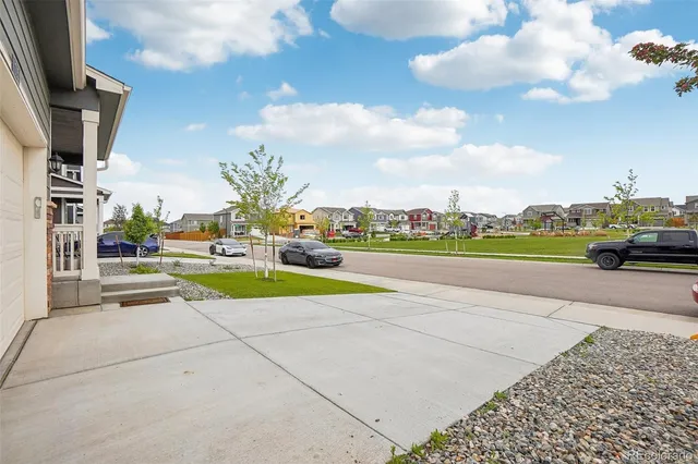 a view of yard with swimming pool and seating