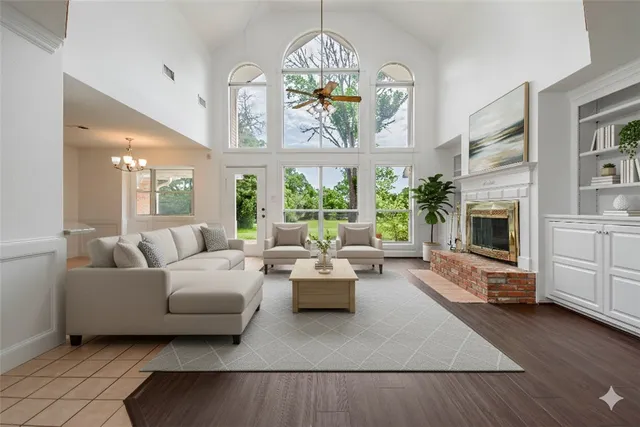 a living room with furniture fireplace and flat screen tv
