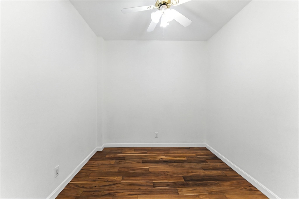 22 Chestnut Place, Unit 608 Brookline, MA 02445 - Photo 12 of 29 a view of room with empty room and wooden floor