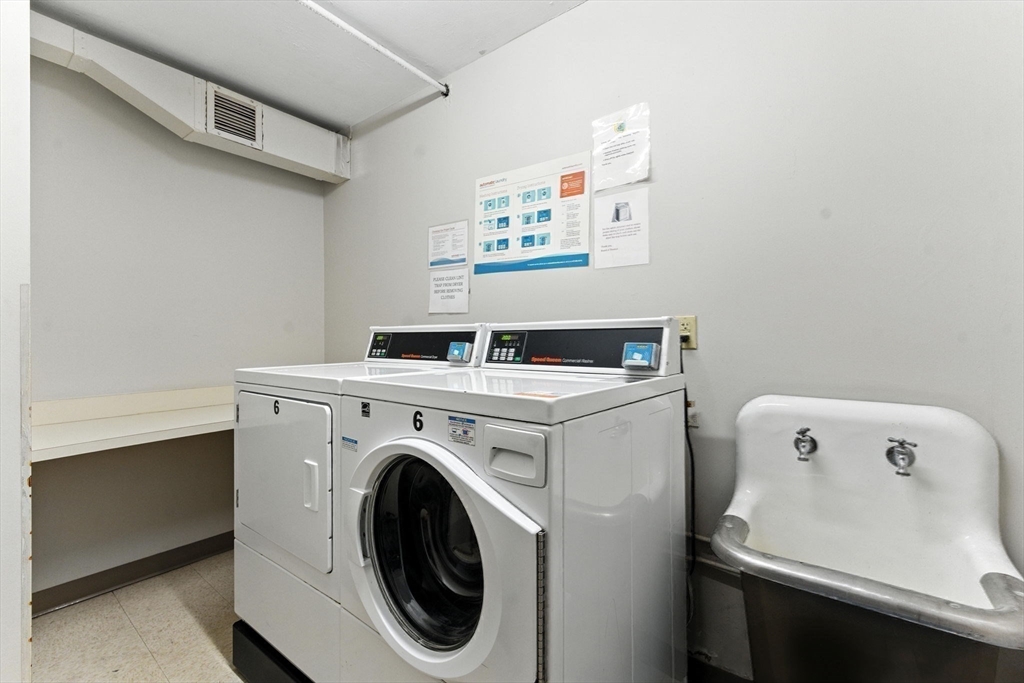 22 Chestnut Place, Unit 608 Brookline, MA 02445 - Photo 18 of 29 a utility room with dryer and washer