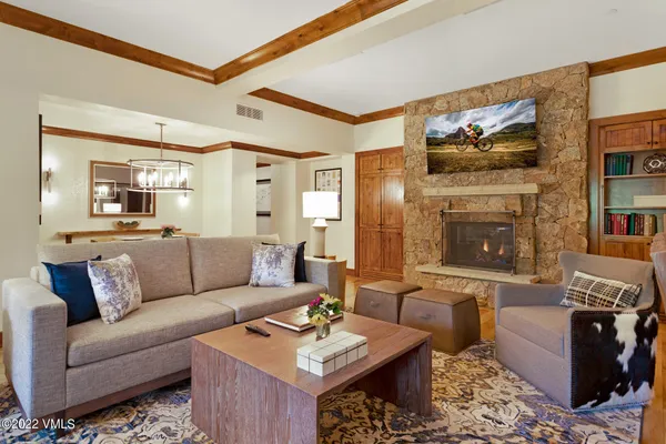 a living room with furniture and a fireplace