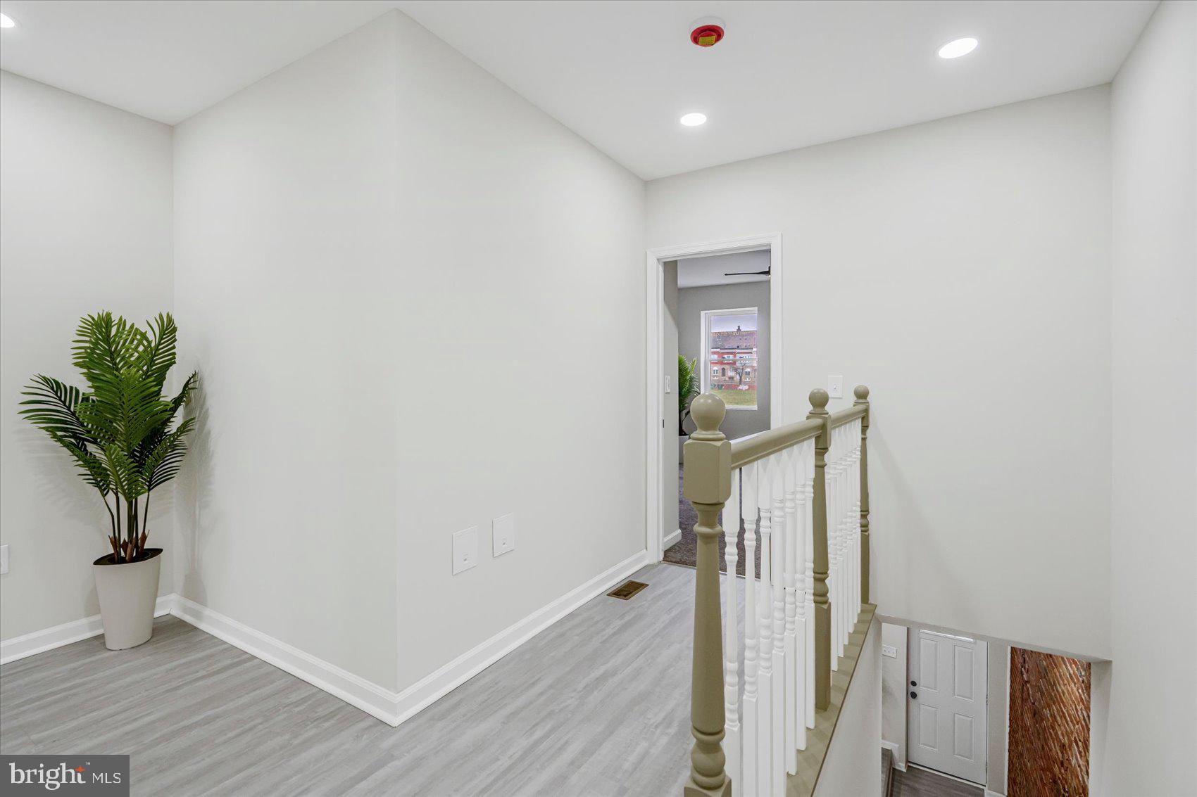 1743 Federal Street Baltimore, MD 21213 - Photo 16 of 47 a view of hallway with wooden floor