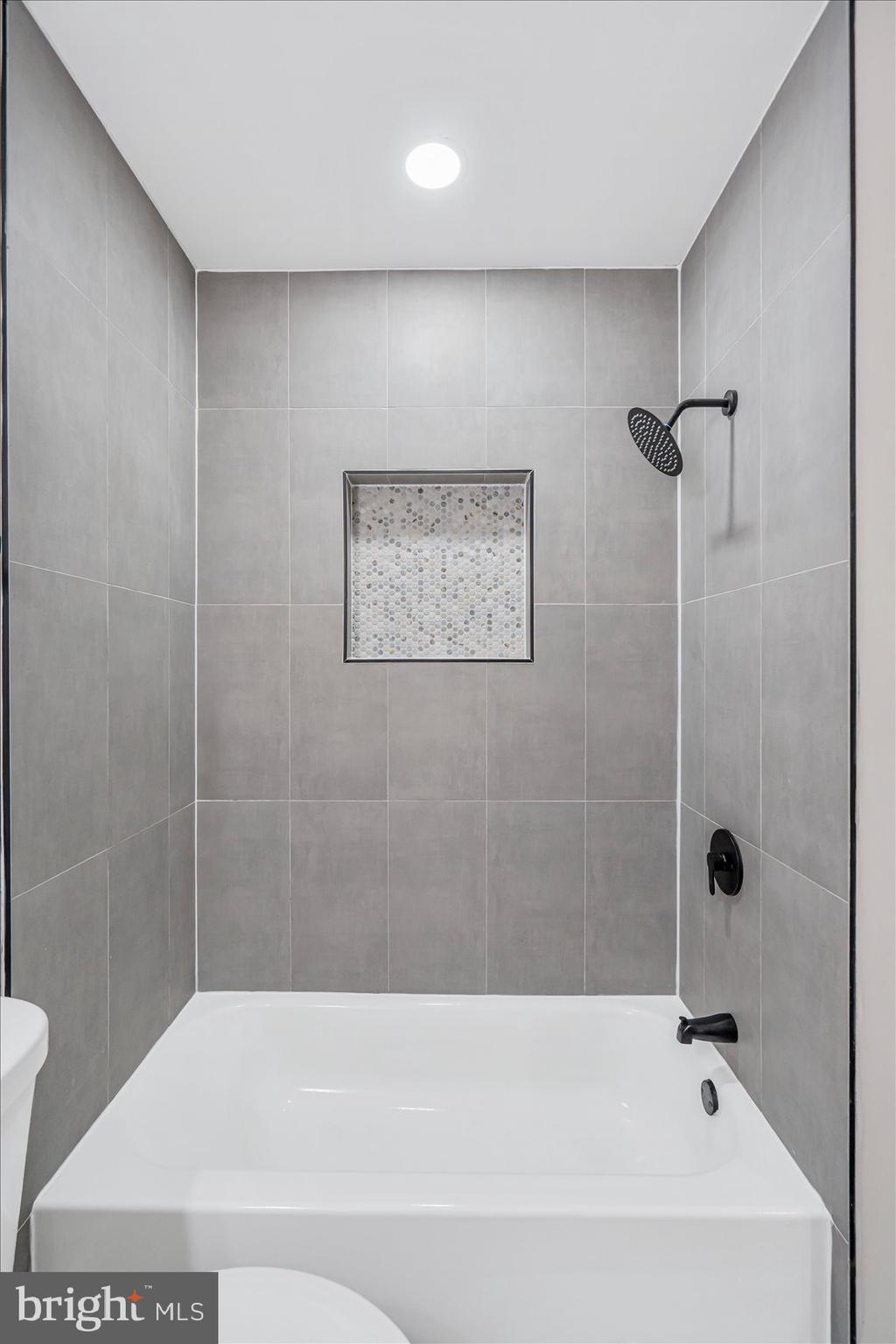 1743 Federal Street Baltimore, MD 21213 - Photo 22 of 47 a bathroom with a bathtub and a toilet