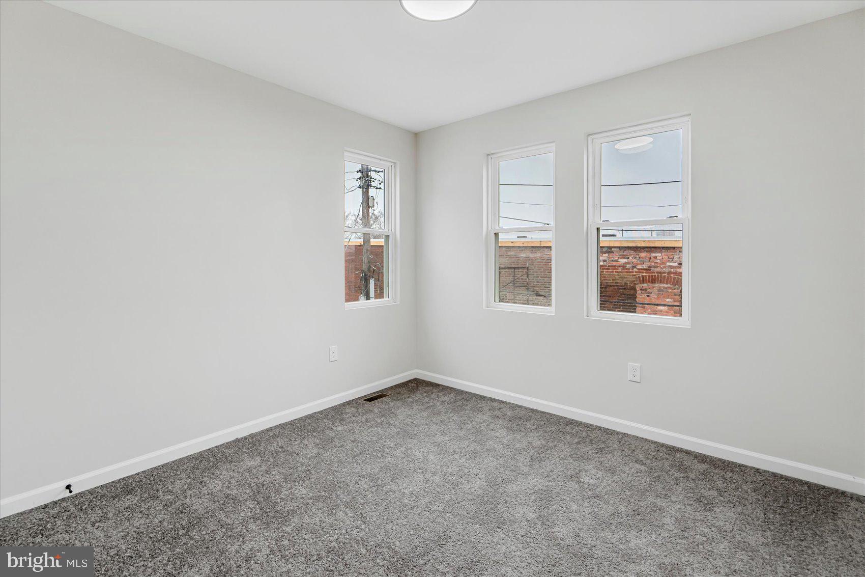 1743 Federal Street Baltimore, MD 21213 - Photo 26 of 47 an empty room with windows