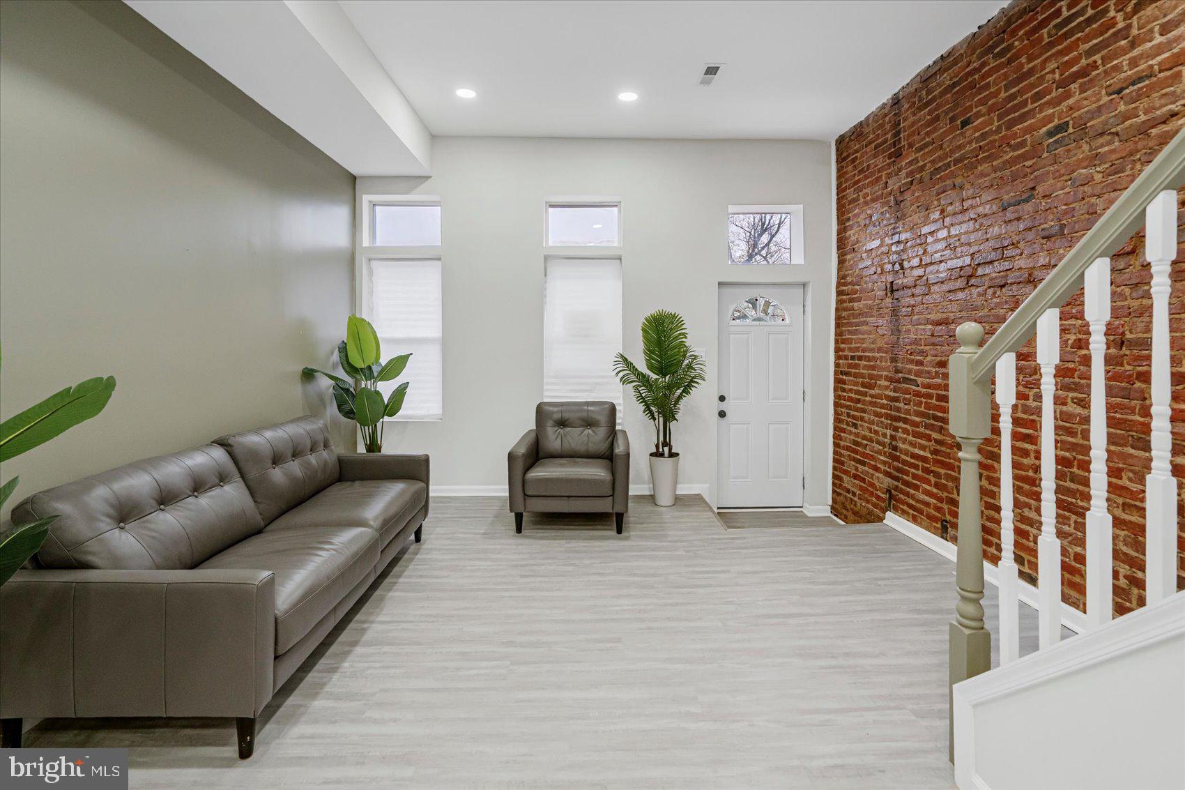 1743 Federal Street Baltimore, MD 21213 - Photo 6 of 47 a living room with furniture and a rug