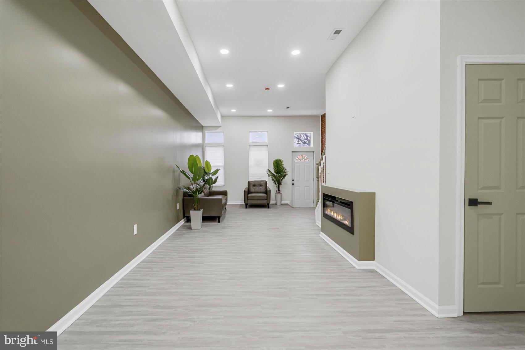 1743 Federal Street Baltimore, MD 21213 - Photo 8 of 47 a living room with furniture and a potted plant