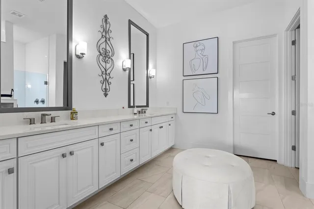 a living room with patio furniture and a floor to ceiling window