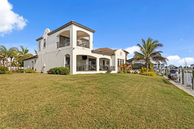 a view of a lake with boats and trees in the background