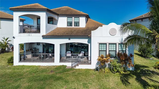 a swimming pool with an outdoor space and seating area