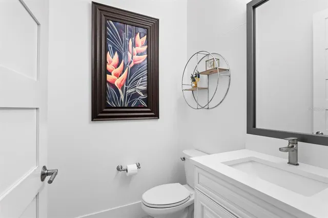 a living room with fireplace furniture and a large window