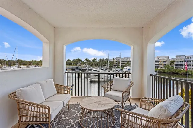 a outdoor space with lots of tables a chairs and a barbeque