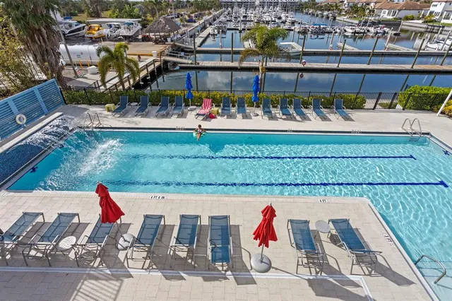 an aerial view of a tennis ground and a yard