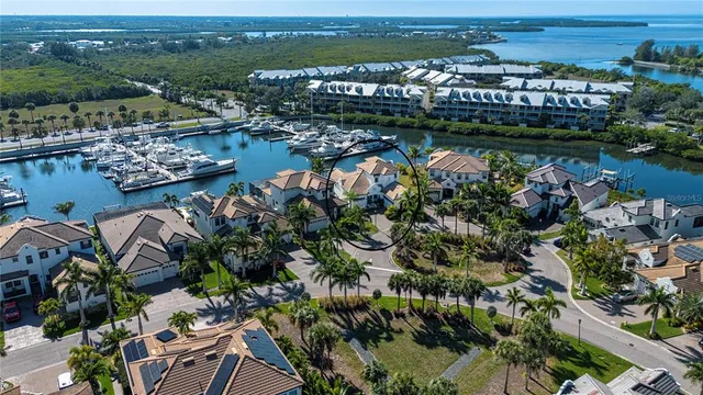 a front view of a house with a tree