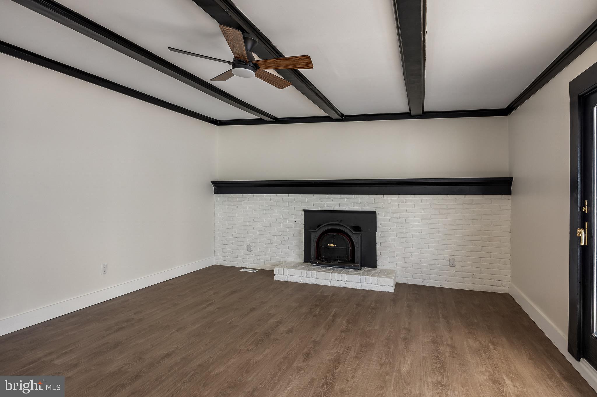22 Willow Ridge Road Marlton, NJ 08053 - Photo 13 of 29 a view of a livingroom with wooden floor and a fireplace