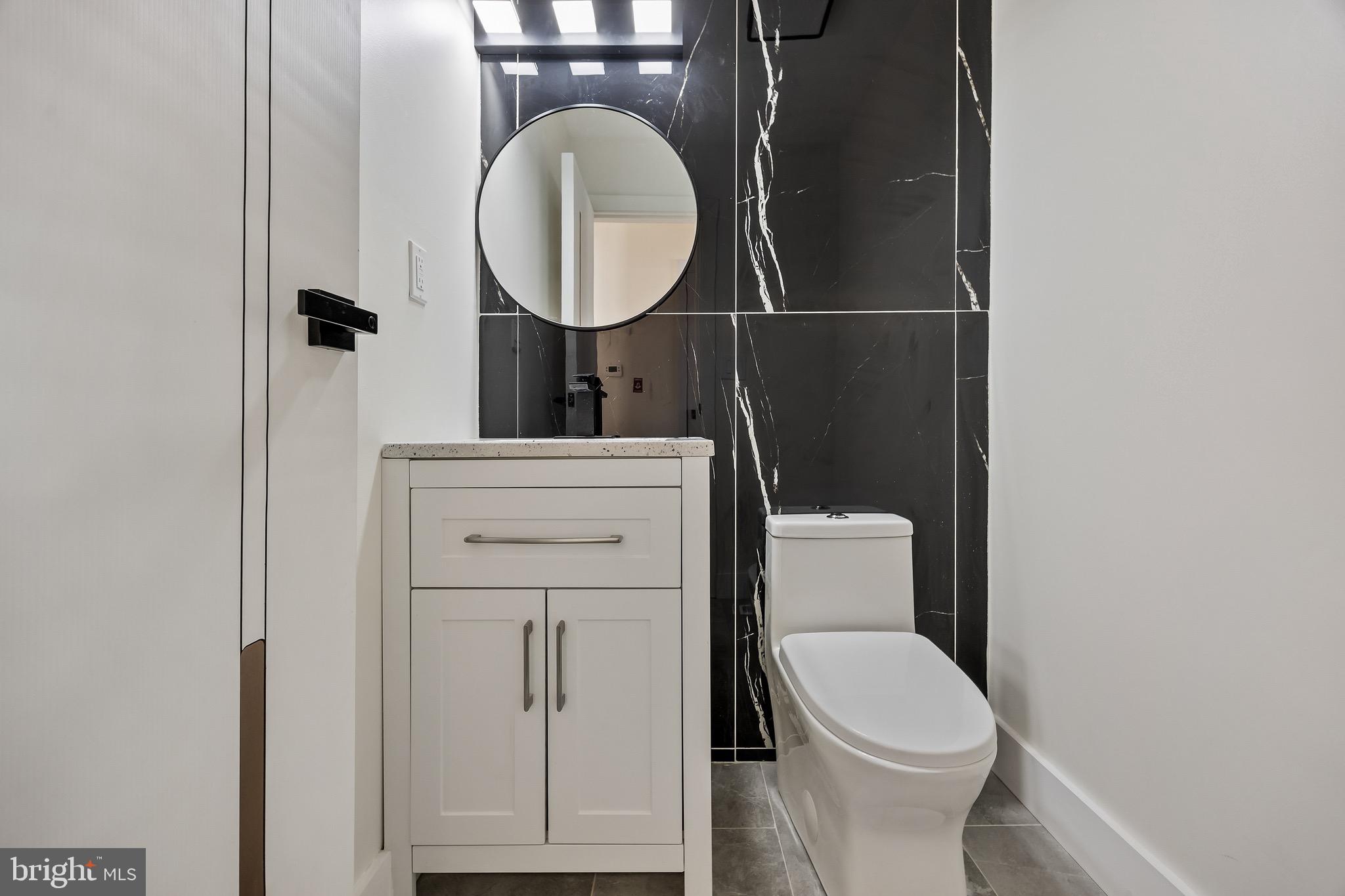 22 Willow Ridge Road Marlton, NJ 08053 - Photo 16 of 29 a bathroom with a toilet and a mirror