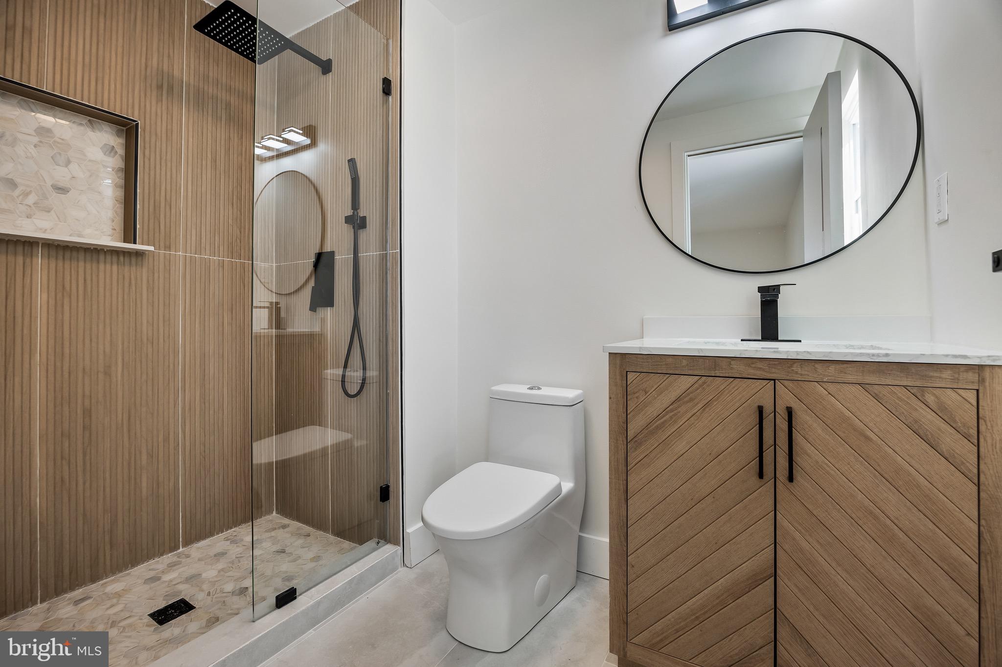 22 Willow Ridge Road Marlton, NJ 08053 - Photo 19 of 29 a bathroom with a toilet a sink and mirror