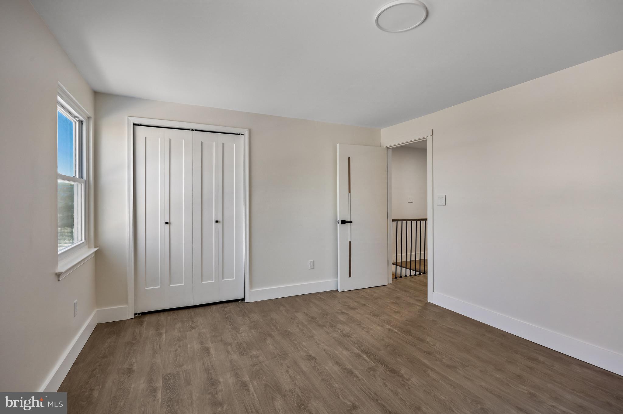 22 Willow Ridge Road Marlton, NJ 08053 - Photo 24 of 29 a view of an empty room with wooden floor