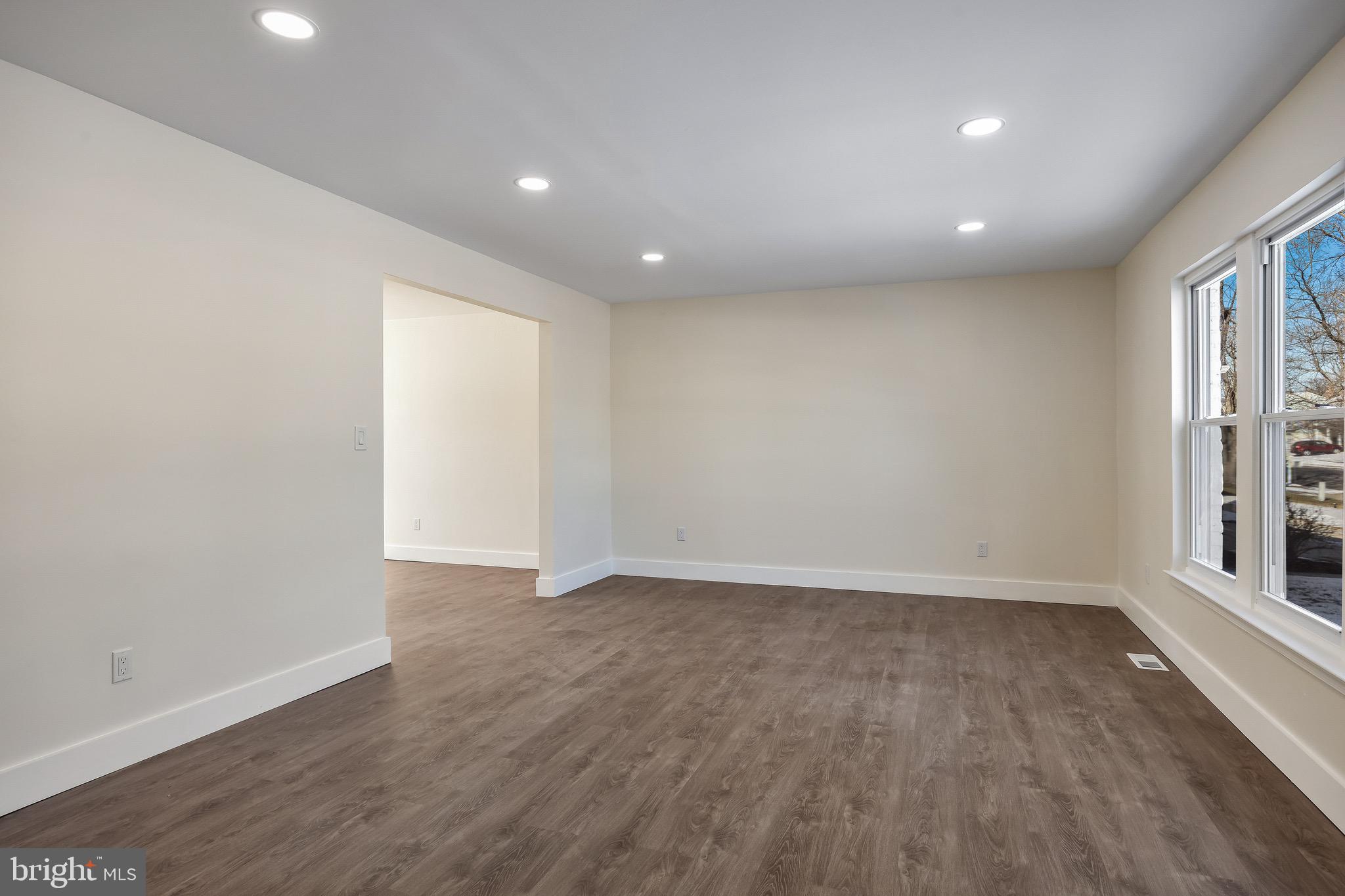 22 Willow Ridge Road Marlton, NJ 08053 - Photo 6 of 29 a view of an empty room with wooden floor and a window