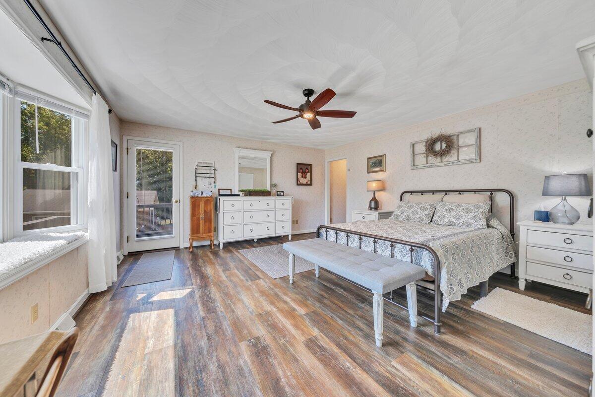 3226 Rakes Road Rocky Mount, VA 24151 - Photo 31 of 74 a spacious bedroom with a bed and wooden floor