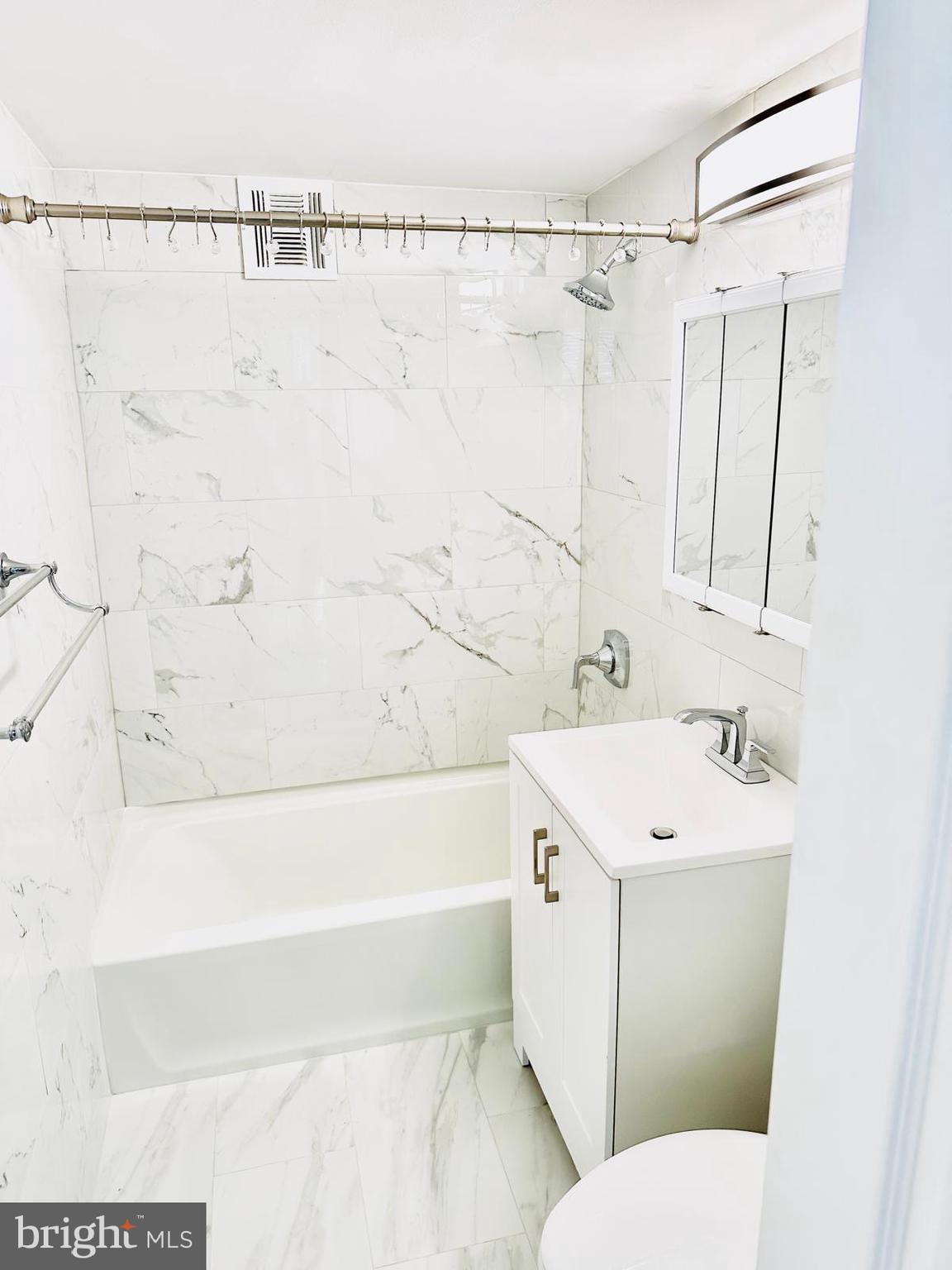 4401 Cherry Hill Road, Unit 67 Arlington, VA 22207 - Photo 17 of 23 a bathroom with a sink a toilet and shower