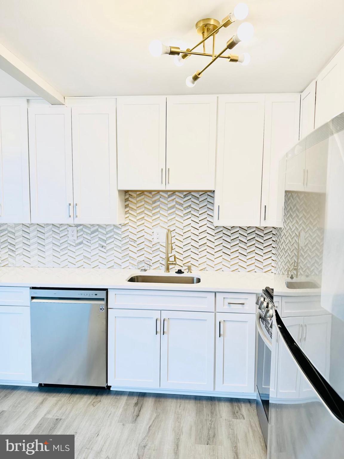 4401 Cherry Hill Road, Unit 67 Arlington, VA 22207 - Photo 21 of 23 a kitchen with granite countertop white cabinets and a sink