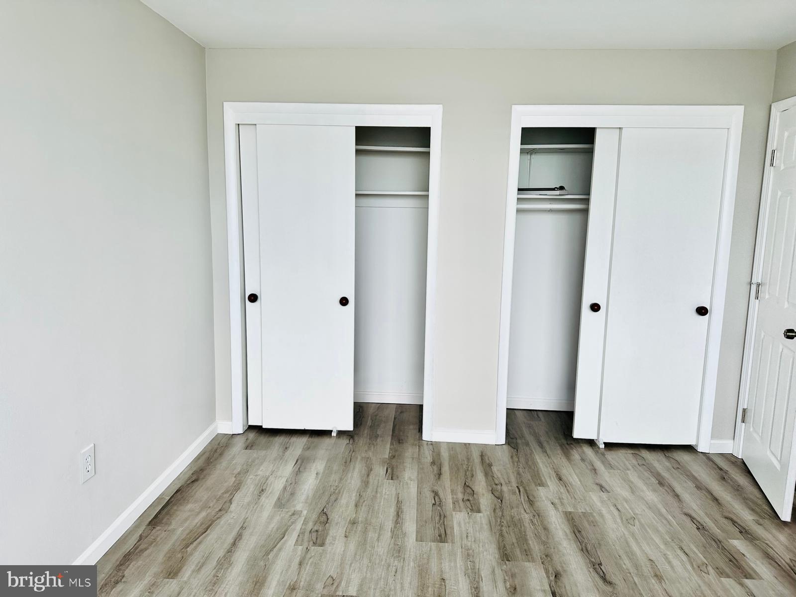 4401 Cherry Hill Road, Unit 67 Arlington, VA 22207 - Photo 9 of 23 an empty room with wooden floor and closet