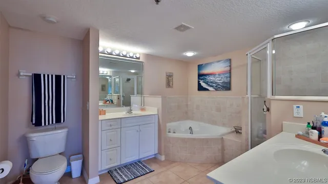 a bathroom with a toilet a sink and bathtub