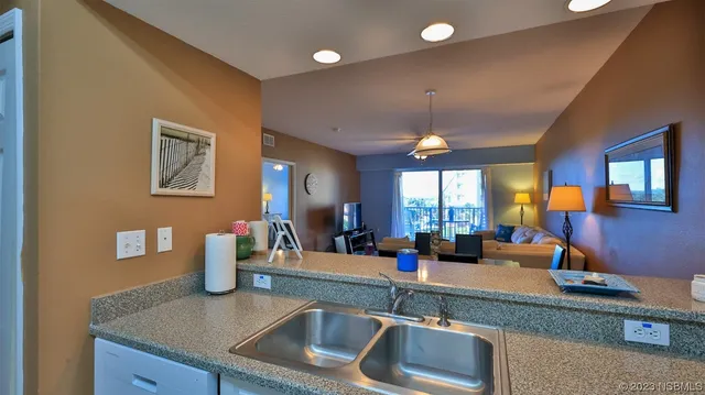 a kitchen with granite countertop a sink and a counter top space