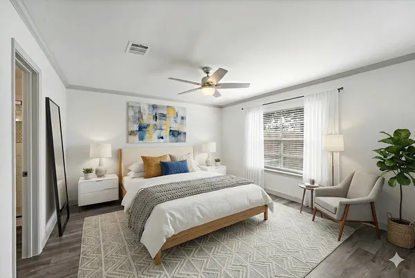 a bedroom with a bed and a window