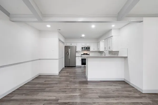a view of kitchen with wooden floor