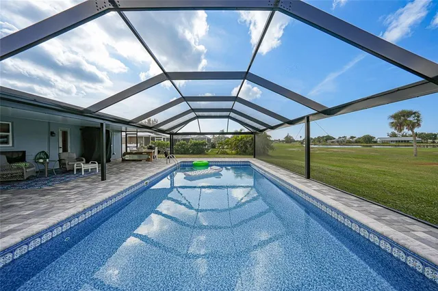 a view of swimming pool with yard