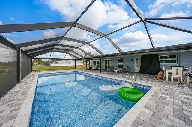 a view of swimming pool with seating area