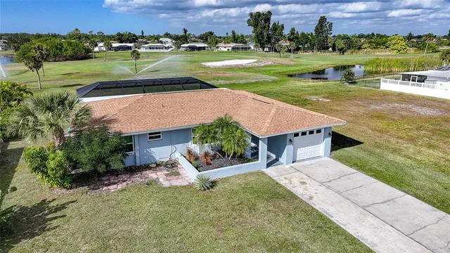 an aerial view of a house with outdoor space