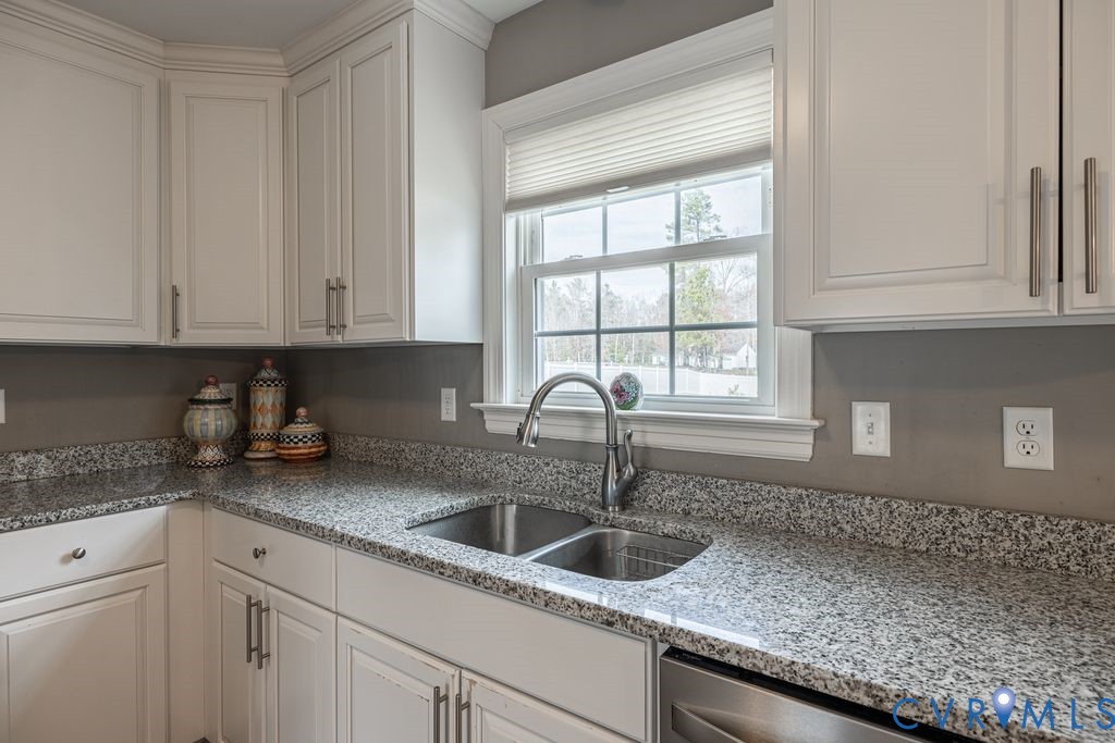241 Pleasant View Drive Aylett, VA 23009 - Photo 13 of 36 a kitchen with granite countertop a sink window and cabinets