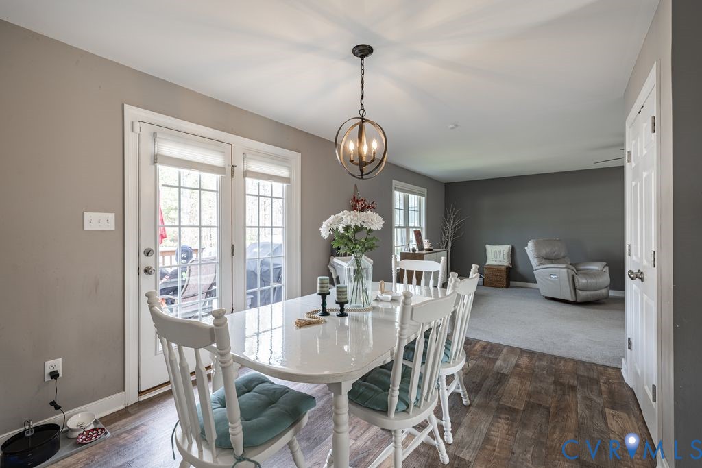 241 Pleasant View Drive Aylett, VA 23009 - Photo 19 of 36 a view of a dining room with furniture wooden floor and a chandelier