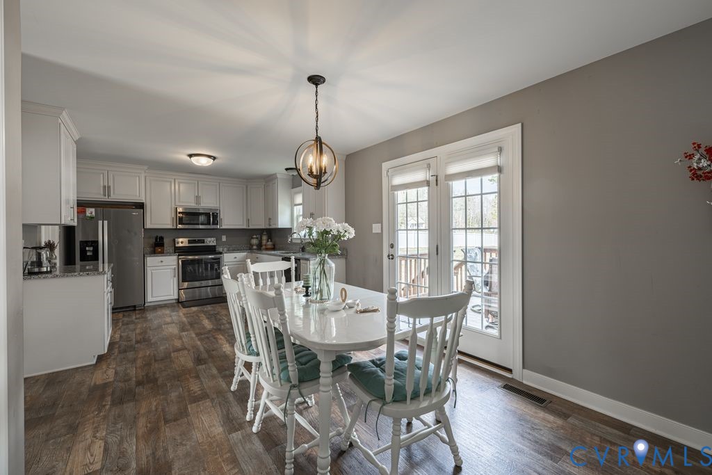 241 Pleasant View Drive Aylett, VA 23009 - Photo 20 of 36 a view of a dining room with furniture window and wooden floor