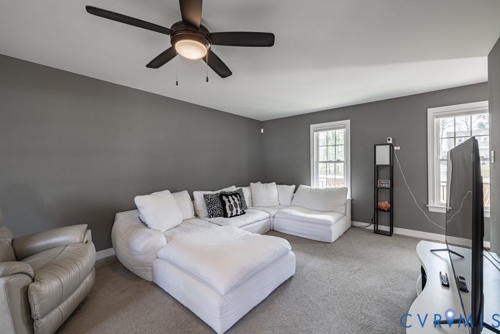 241 Pleasant View Drive Aylett, VA 23009 - Photo 21 of 36 a living room with furniture and a chandelier