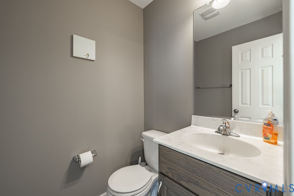 241 Pleasant View Drive Aylett, VA 23009 - Photo 26 of 36 a bathroom with a sink a toilet and a mirror
