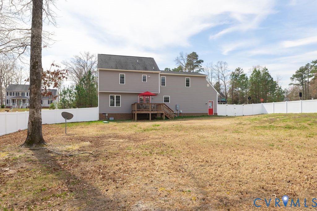 241 Pleasant View Drive Aylett, VA 23009 - Photo 5 of 36 a view of a house with backyard and trees in the background