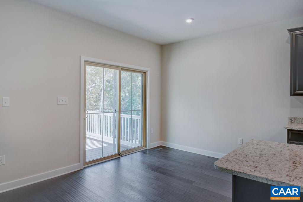 351 Winding Road Keswick, VA 22947 - Photo 7 of 21 an empty room with wooden floor and windows