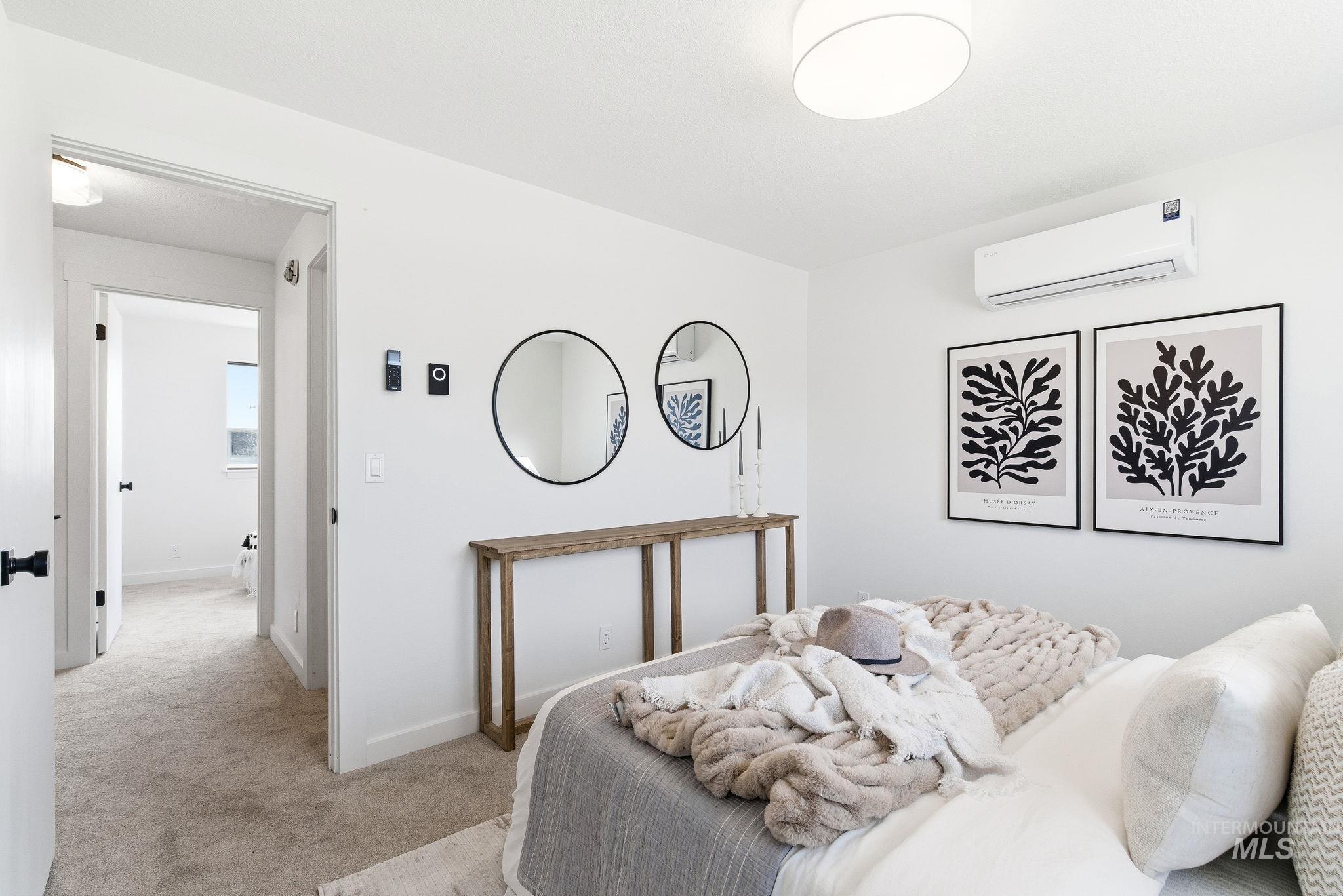 8443 West Rifleman Street Boise, ID 83704 - Photo 23 of 39 Bedroom with light carpet and a mini split for heating / cooling