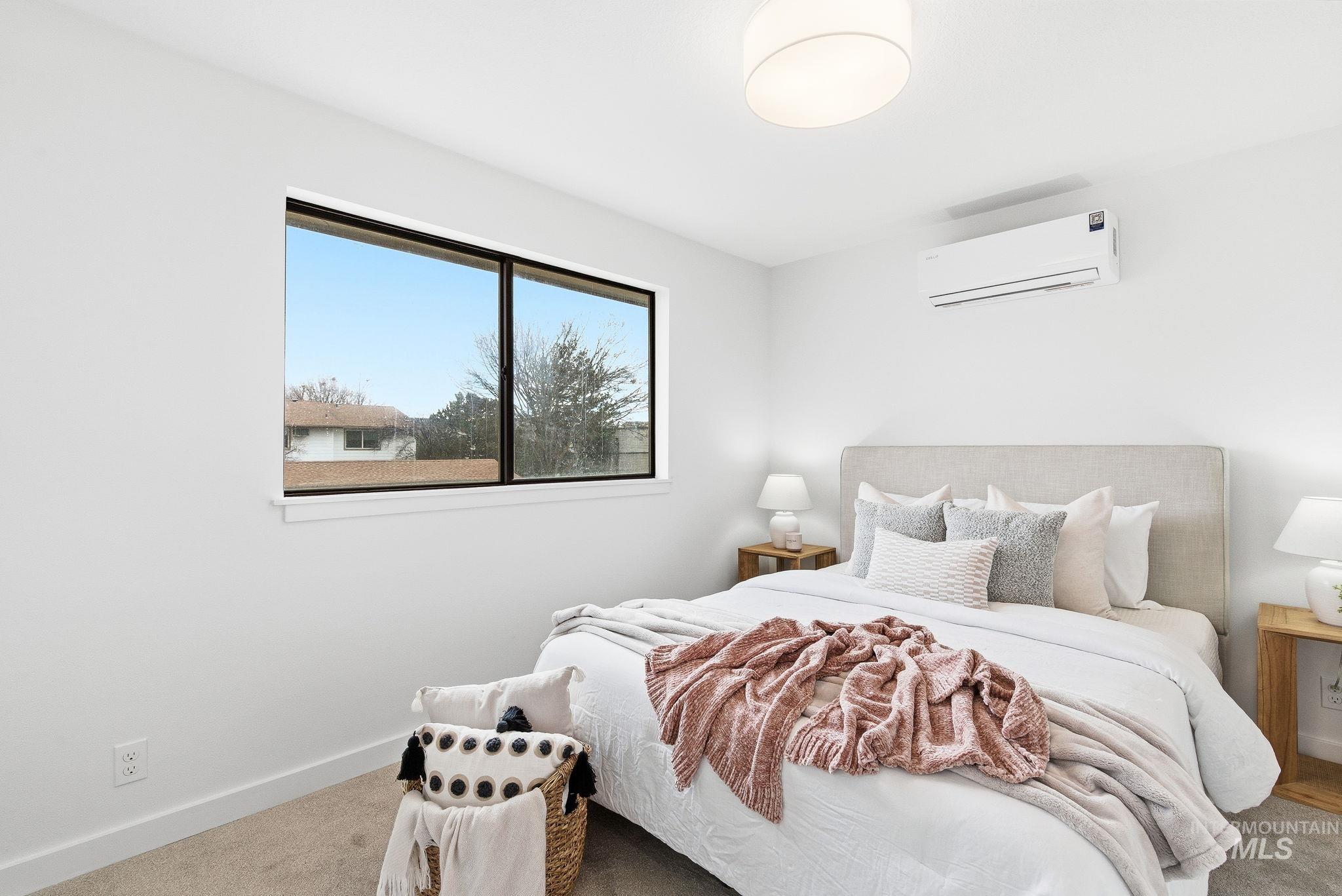 8443 West Rifleman Street Boise, ID 83704 - Photo 28 of 39 Bedroom with carpet flooring and a mini split for heating / cooling