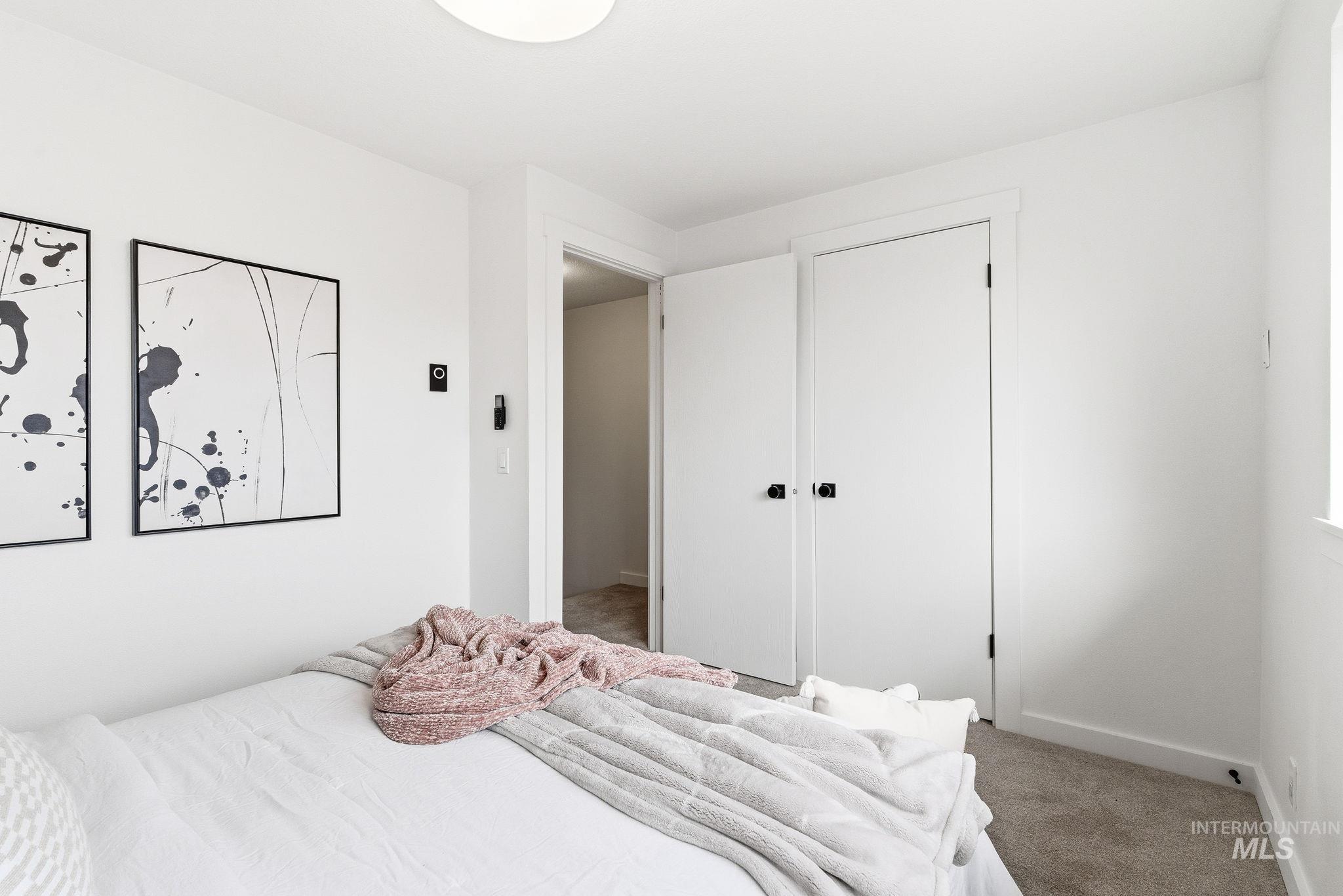 8443 West Rifleman Street Boise, ID 83704 - Photo 30 of 39 Carpeted bedroom with baseboards