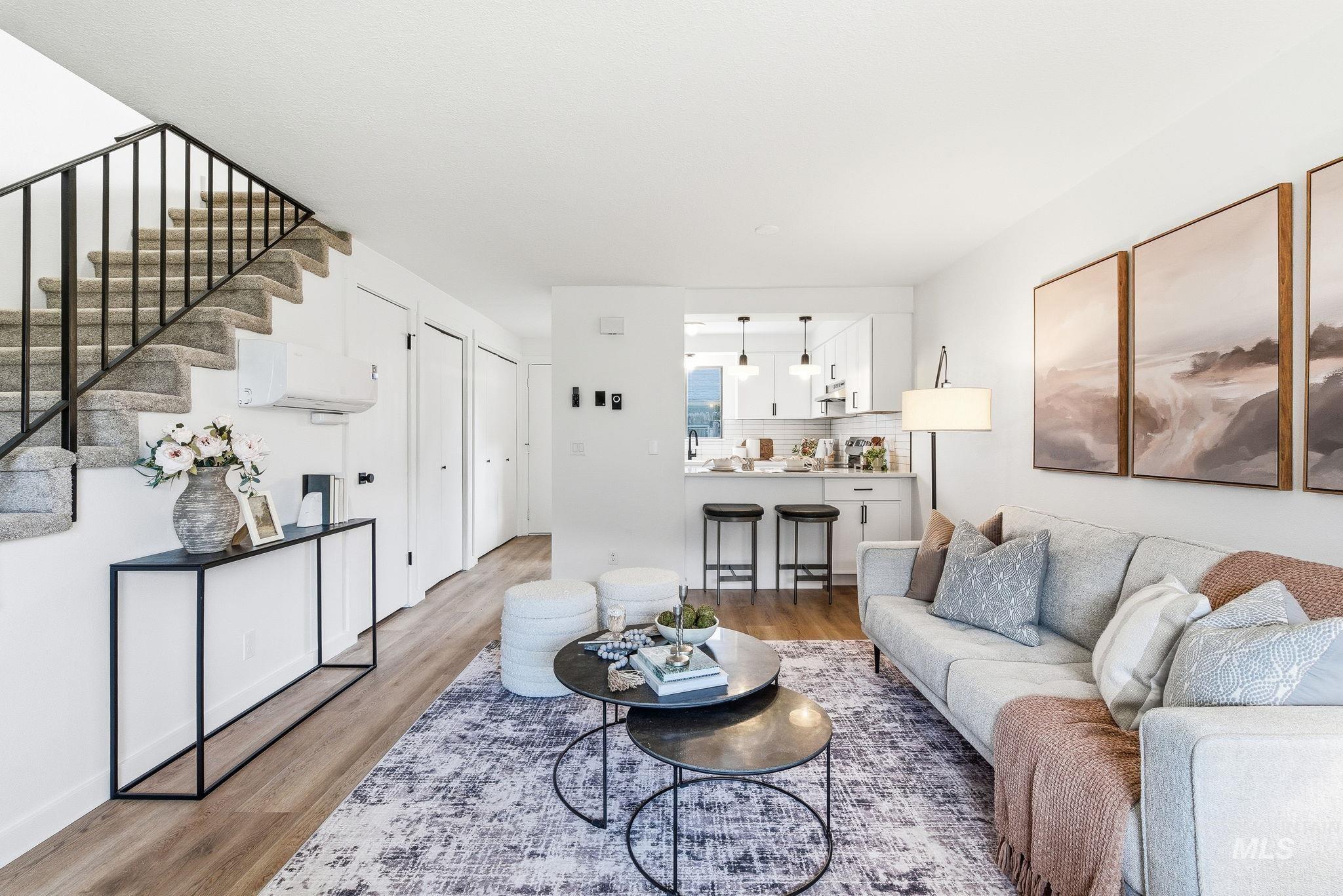8443 West Rifleman Street Boise, ID 83704 - Photo 4 of 39 Living room with wood finished floors and a wall mounted mini split